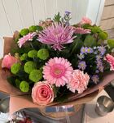 Pink Perfect - A cheerful hand-tied bouquet of pink gerberas and fresh green chrysanthemums, beautifully arranged by Forget Me Nots in Cheadle.